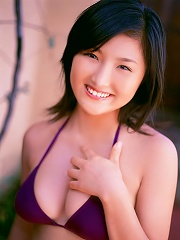 Short haired gravure idol with big boobs wearing a bikini